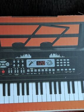 New In Box Electronic Keyboard Piano  - Orange and Black